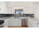 Bright kitchen features stainless steel appliances, white cabinets, and a window view at 1165 E Avenida Kino --, Casa Grande, AZ 85122