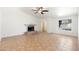 Inviting living room featuring a fireplace, ceramic tile floors, neutral walls, and arched doorways at 1165 E Avenida Kino --, Casa Grande, AZ 85122