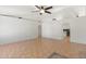 Spacious living room featuring neutral walls, ceramic tile floors, arched doorways, and a ceiling fan at 1165 E Avenida Kino --, Casa Grande, AZ 85122
