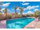 Sparkling backyard pool is surrounded by desert landscaping and a block fence for privacy at 1165 E Avenida Kino --, Casa Grande, AZ 85122