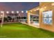 This backyard offers an outdoor seating area, swing set, and an outdoor covered area at 12229 N 121St Dr, El Mirage, AZ 85335
