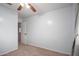 Bedroom featuring blue walls and carpet with plenty of natural light at 12229 N 121St Dr, El Mirage, AZ 85335