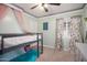 Charming bedroom featuring bunk beds and light green walls at 12229 N 121St Dr, El Mirage, AZ 85335