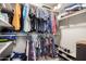 Organized walk-in closet with hanging clothes and shoe storage at 12229 N 121St Dr, El Mirage, AZ 85335