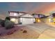 Charming two-story home with a two-car garage, desert landscaping, and inviting curb appeal at 12229 N 121St Dr, El Mirage, AZ 85335