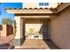 Inviting front porch with seating area offers a cozy welcome to the home at 12229 N 121St Dr, El Mirage, AZ 85335