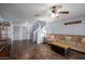 Spacious living area with stairs, grey accent wall and vinyl plank flooring at 12229 N 121St Dr, El Mirage, AZ 85335