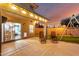 Outdoor patio featuring comfortable seating, ambient lighting, and sunset view at 12229 N 121St Dr, El Mirage, AZ 85335