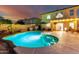 Lush backyard with a sparkling pool, patio seating, and well-maintained landscaping, ideal for outdoor enjoyment at 12229 N 121St Dr, El Mirage, AZ 85335