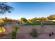 Expansive community green space featuring manicured lawn, walking paths, and a secure decorative fence at 12229 N 121St Dr, El Mirage, AZ 85335