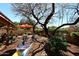 Relaxing backyard with a sitting area, mature landscaping, and shade trees at 13390 N 95Th Way, Scottsdale, AZ 85260