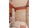 Bathroom featuring a tiled shower and tub with decorative tiles at 13390 N 95Th Way, Scottsdale, AZ 85260