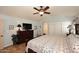 Bedroom with a ceiling fan, a dresser, and a closet with sliding doors at 13390 N 95Th Way, Scottsdale, AZ 85260