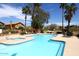Inviting community pool with lounge chairs, tables, and lush landscaping in a Gathering-friendly neighborhood at 13390 N 95Th Way, Scottsdale, AZ 85260