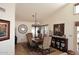 Elegant dining room boasts a chandelier, large windows, and stylish furnishings at 13390 N 95Th Way, Scottsdale, AZ 85260