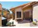 Charming front entrance features a tiled roof, decorative plants, and a secure entry door at 13390 N 95Th Way, Scottsdale, AZ 85260
