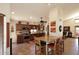 Spacious kitchen featuring wooden cabinets, granite countertops, and stainless steel appliances at 13390 N 95Th Way, Scottsdale, AZ 85260