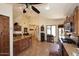 Open kitchen design with custom wood cabinetry and central island with bar seating at 13390 N 95Th Way, Scottsdale, AZ 85260