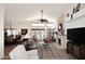 Open living room with high ceilings, a stone fireplace, neutral colors, and views to the outdoor space at 13390 N 95Th Way, Scottsdale, AZ 85260