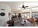 Spacious living room features vaulted ceilings, a ceiling fan, and access to the dining room at 13390 N 95Th Way, Scottsdale, AZ 85260