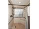 Tiled shower with glass block window and a built-in bench at 13390 N 95Th Way, Scottsdale, AZ 85260