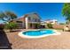 Expansive backyard with a sparkling pool, mature trees, and lush landscaping, perfect for outdoor entertaining at 13711 N 81St Ave, Peoria, AZ 85381