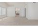 Bright bedroom with plush carpet and an en suite bathroom at 13711 N 81St Ave, Peoria, AZ 85381