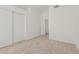 Clean bedroom featuring neutral carpet, a closet with sliding doors, and easy access to other rooms at 13711 N 81St Ave, Peoria, AZ 85381