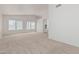 Bedroom features plush carpet, vaulted ceiling, and natural light from the windows at 13711 N 81St Ave, Peoria, AZ 85381