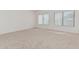 Neutral bedroom features plush carpeting, vaulted ceiling, and natural light from windows at 13711 N 81St Ave, Peoria, AZ 85381
