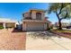 Charming two-story home featuring a neutral stucco exterior, tile roof, and a spacious two-car garage at 13711 N 81St Ave, Peoria, AZ 85381