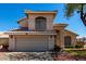 Charming two-story home featuring a neutral stucco exterior, tile roof, and a spacious two-car garage at 13711 N 81St Ave, Peoria, AZ 85381