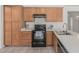 Traditional kitchen features tile floors, light wood cabinets and modern appliances at 13711 N 81St Ave, Peoria, AZ 85381