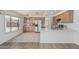 Bright kitchen with white countertops, stainless appliances, and view of the backyard pool at 13711 N 81St Ave, Peoria, AZ 85381