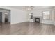 Inviting living room features light flooring, a cozy fireplace, and generous natural light at 13711 N 81St Ave, Peoria, AZ 85381