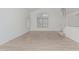 Spacious living room with vaulted ceiling, large window, and staircase at 13711 N 81St Ave, Peoria, AZ 85381