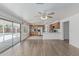 Bright open living and kitchen area with sliding glass doors to a refreshing pool at 13711 N 81St Ave, Peoria, AZ 85381