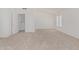 Spacious carpeted bedroom with abundant natural light and an adjoining bathroom at 13711 N 81St Ave, Peoria, AZ 85381