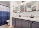Bathroom with double sink, grey cabinets, white countertop, and modern black fixtures at 1449 E Kent Ave, Chandler, AZ 85225