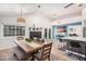 Open concept dining room with views to kitchen and living room at 1449 E Kent Ave, Chandler, AZ 85225
