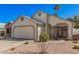 Charming single-Gathering home with desert landscaping and a two-car garage on a clear day at 1449 E Kent Ave, Chandler, AZ 85225