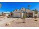 Charming single-Gathering home with desert landscaping and a two-car garage on a clear day at 1449 E Kent Ave, Chandler, AZ 85225