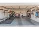 Spacious garage featuring workout equipment, tools and epoxy floor at 1449 E Kent Ave, Chandler, AZ 85225