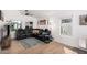 Bright living room with large sectional, modern ceiling fan and natural light at 1449 E Kent Ave, Chandler, AZ 85225