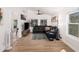 Modern living room with cozy seating, large windows, and sleek hardwood flooring at 1449 E Kent Ave, Chandler, AZ 85225