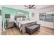 Comfortable main bedroom with a ceiling fan, wood flooring, and window view of the outdoor swimming pool at 1449 E Kent Ave, Chandler, AZ 85225