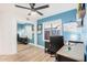 Bright home office with a ceiling fan, mirror closet and a window to let in natural light at 1449 E Kent Ave, Chandler, AZ 85225