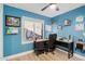 Home office with blue walls, a ceiling fan, and a window that brings in natural light and air at 1449 E Kent Ave, Chandler, AZ 85225