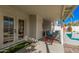 Relaxing covered patio with comfortable seating near a sparkling pool at 1449 E Kent Ave, Chandler, AZ 85225