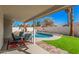 Inviting pool area with lush landscaping, lounge seating, and sunny skies at 1449 E Kent Ave, Chandler, AZ 85225